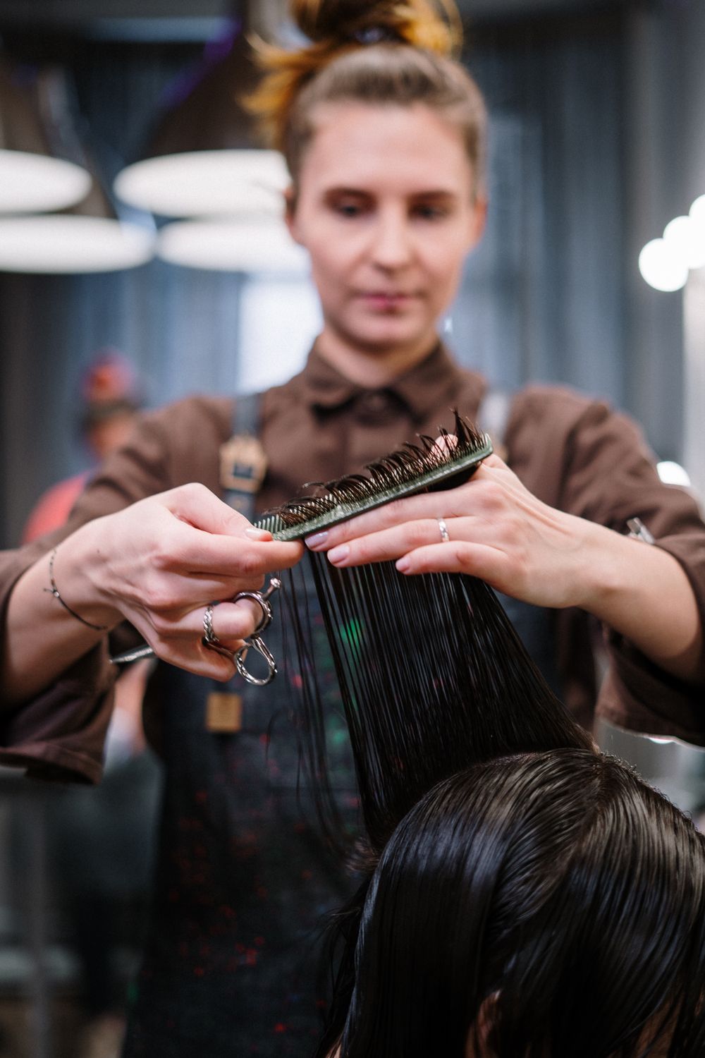 Hairdresser cutting a client’s hair