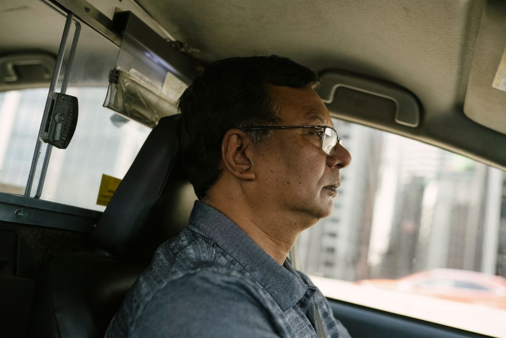 Taxi driver at the wheel